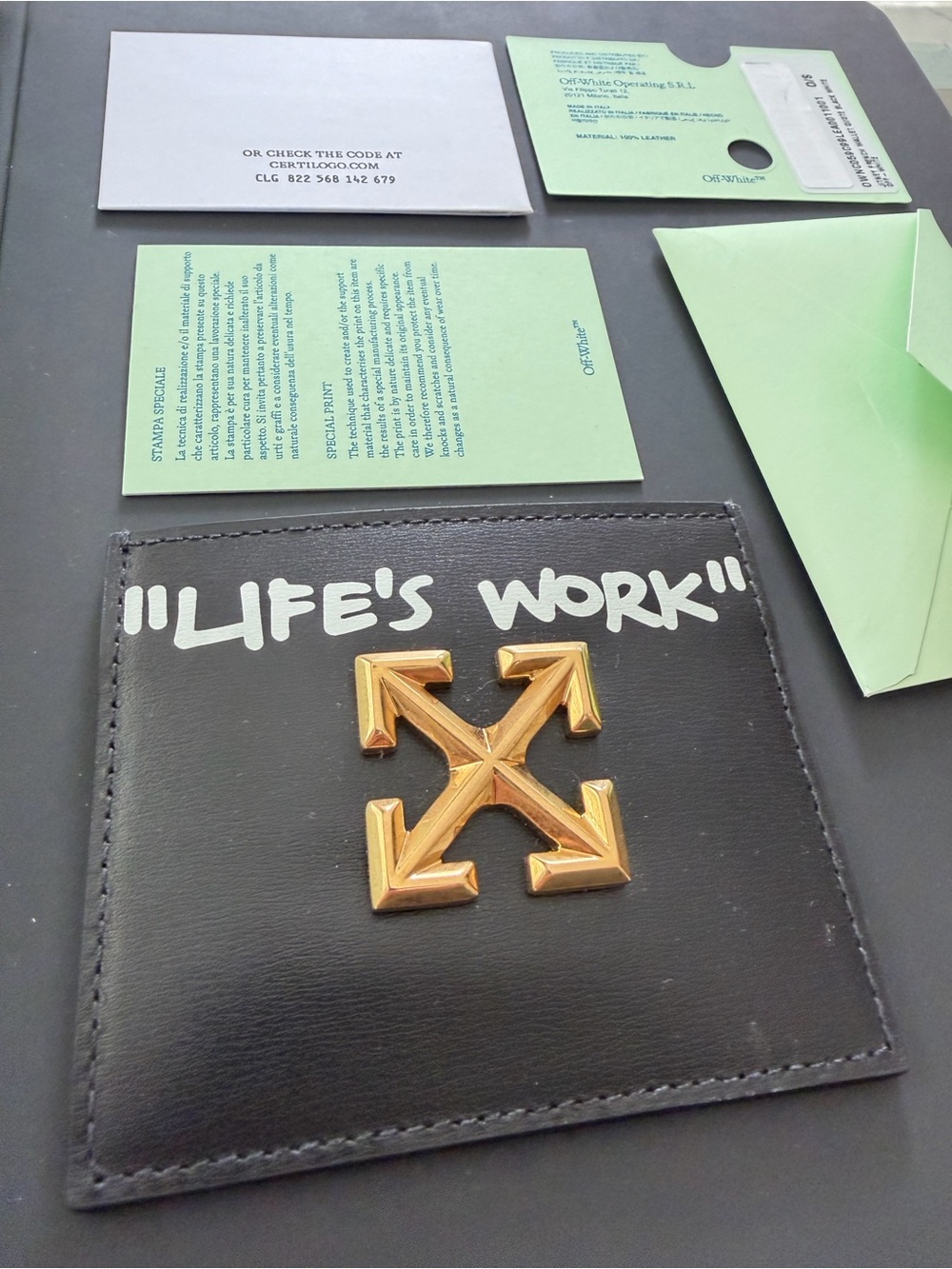 Off-White Black Leather Card Holder with Gold Arrow Motif and White Quote